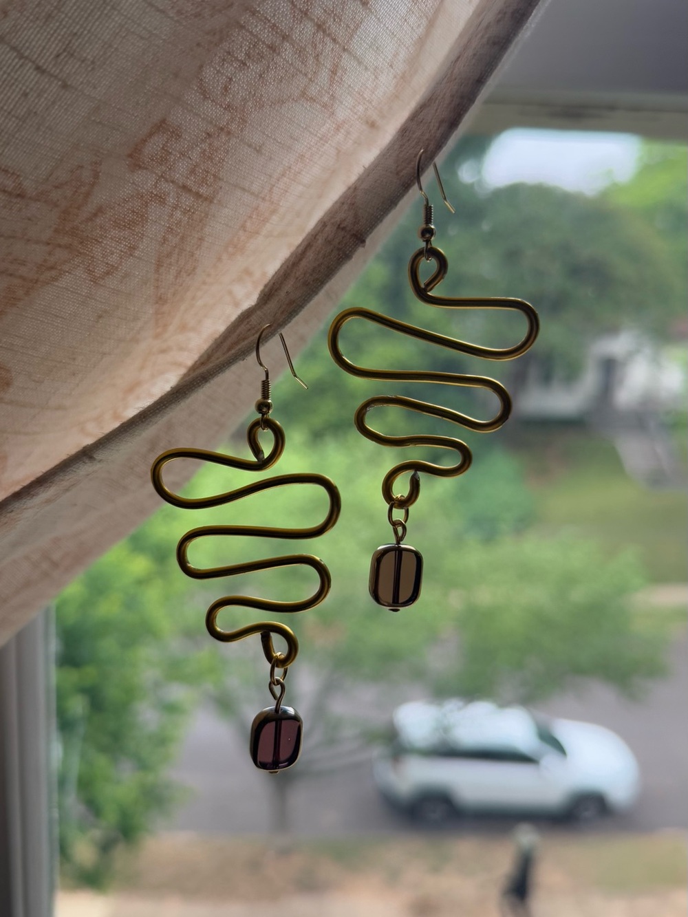 Gold-Tone Wavy Drop Earrings with Purple Glass Beads